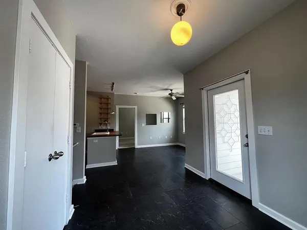 a view of hallway with wooden floor