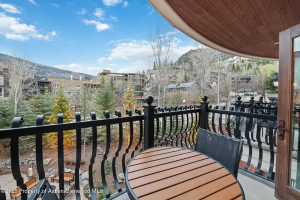 a view of a balcony with wooden floor