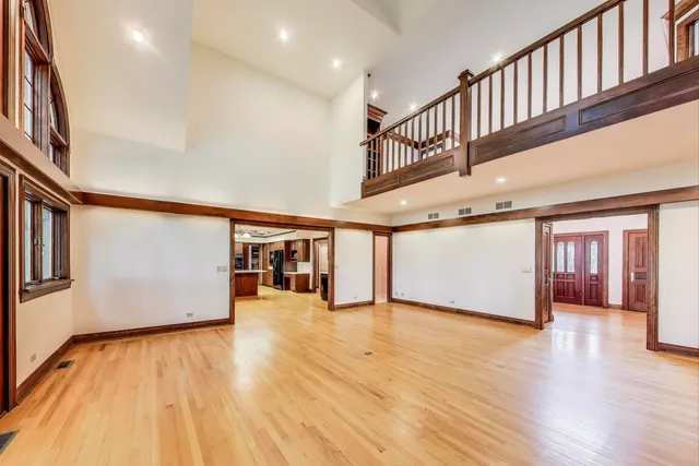 a view of a living room kitchen with furniture and wooden floor