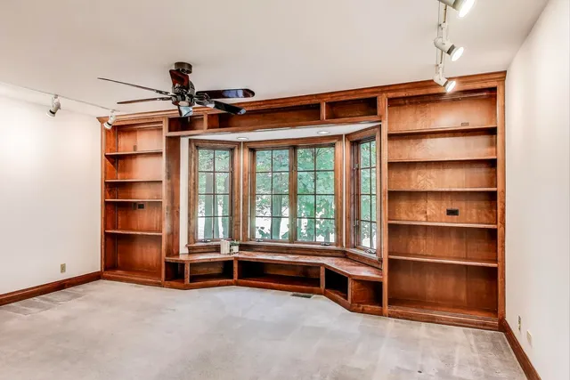 a bathroom with a shower and a glass door