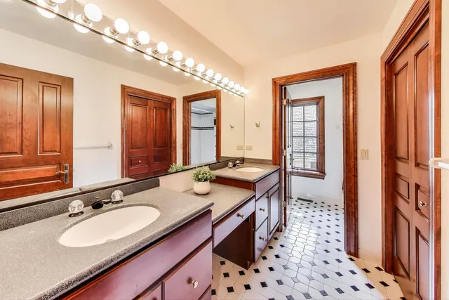 a room with pool table and a refrigerator