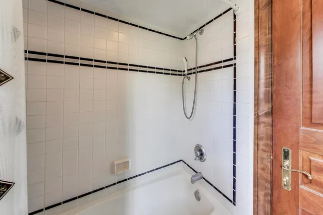 a bathroom with a toilet sink vanity and mirror