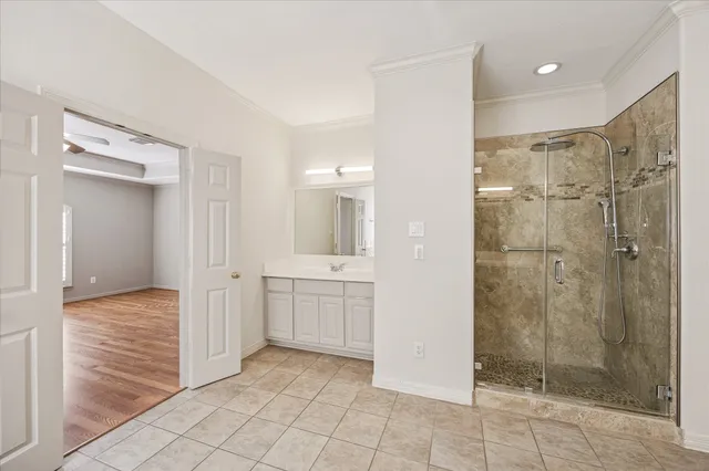 a bathroom with a shower and a sink