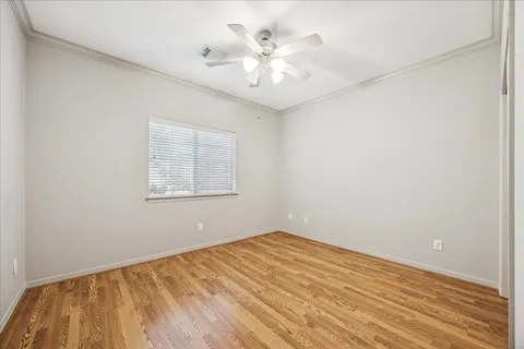 a bathroom with a sink a toilet a mirror a bathtub and shower