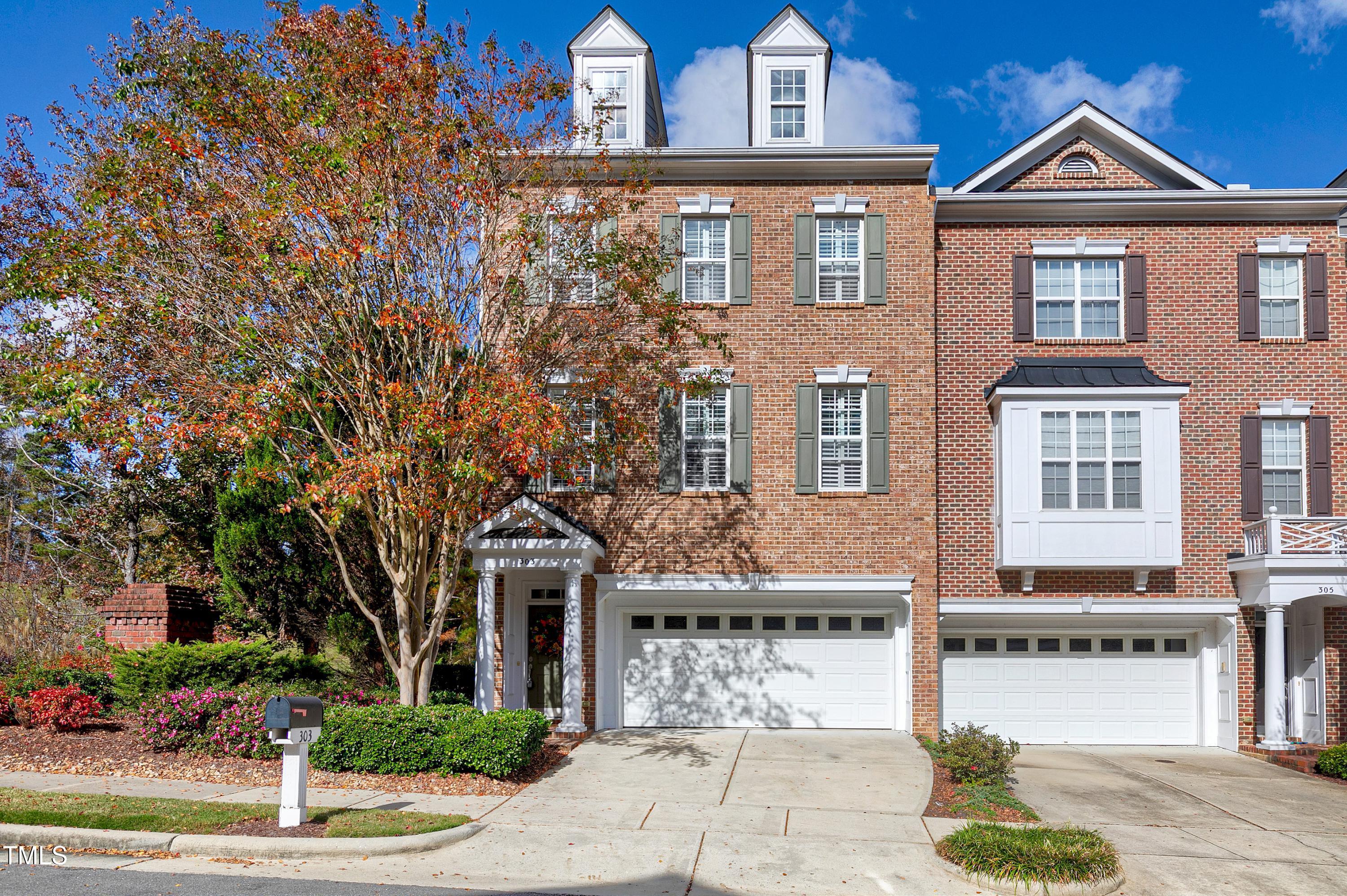 303 Bridgegate Drive Cary, NC 27519 - Photo 17 of 25 a front view of a residential houses with yard