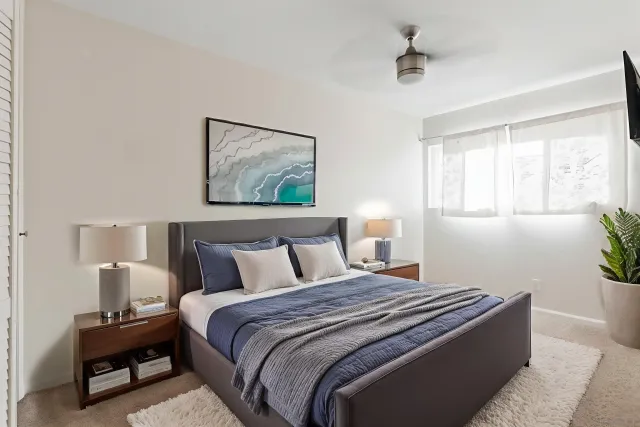 a bedroom with bed and window