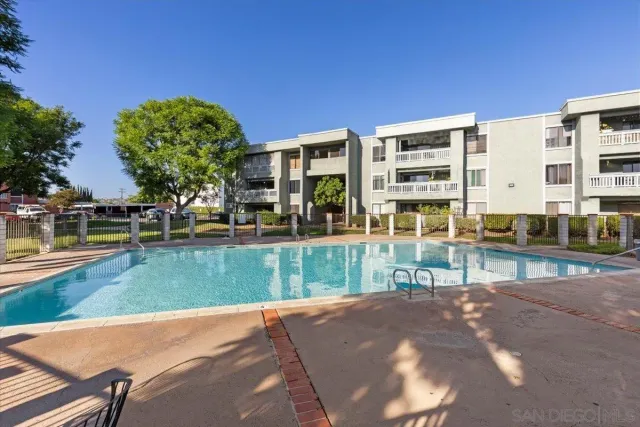 a view of a building with a yard