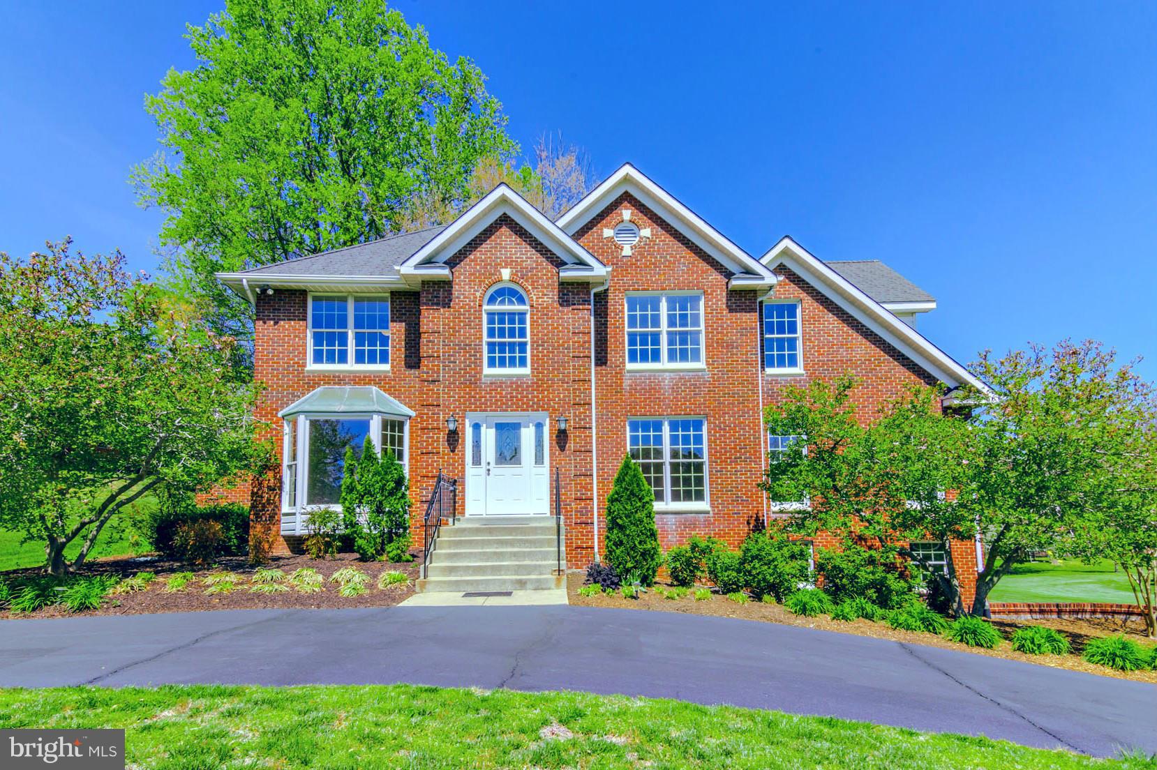 3055 Hickory Ridge Road Dunkirk, MD 20754 - Photo 1 of 29 a front view of a house with yard and green space