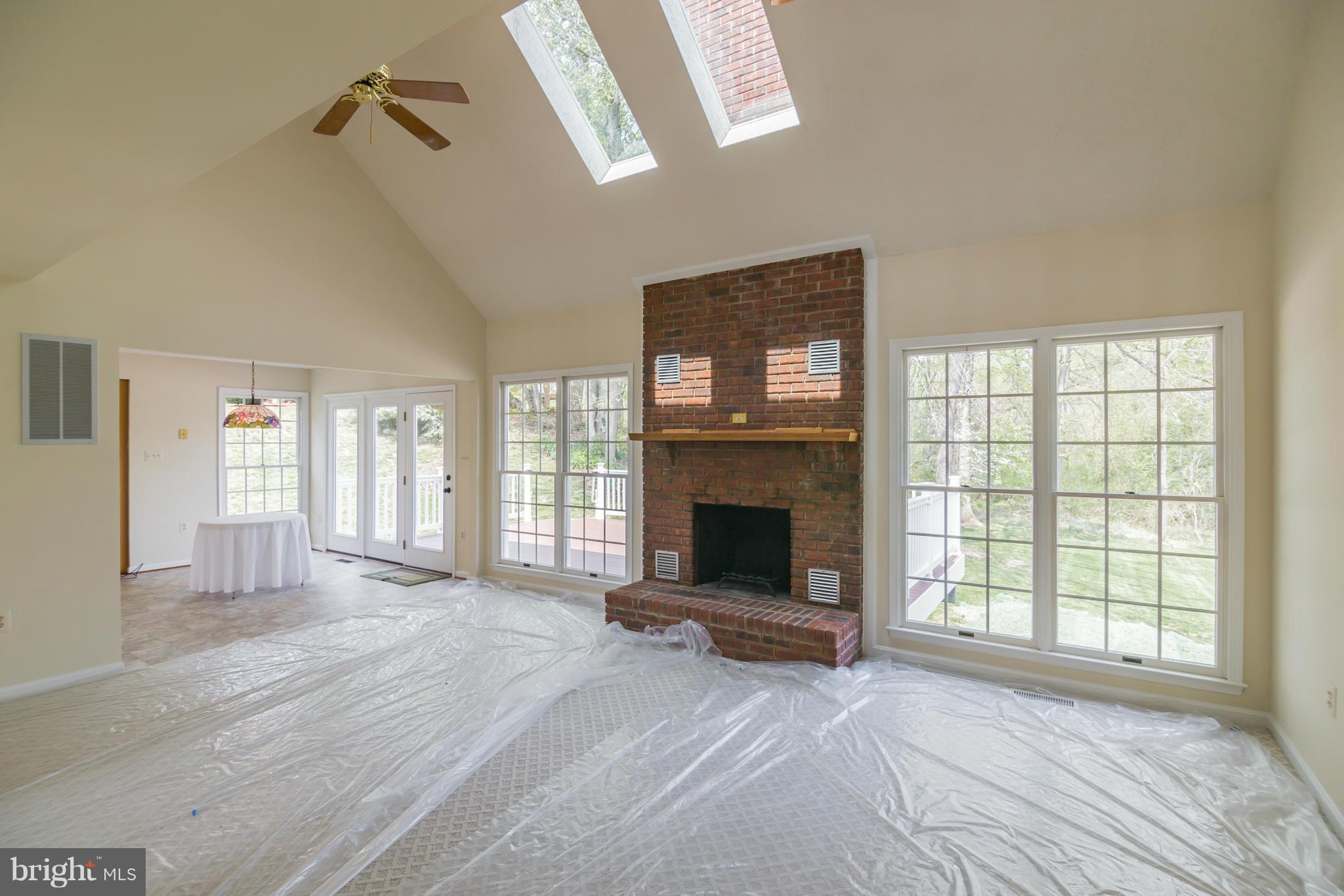 3055 Hickory Ridge Road Dunkirk, MD 20754 - Photo 10 of 29 a view of an empty room with a fireplace and a window