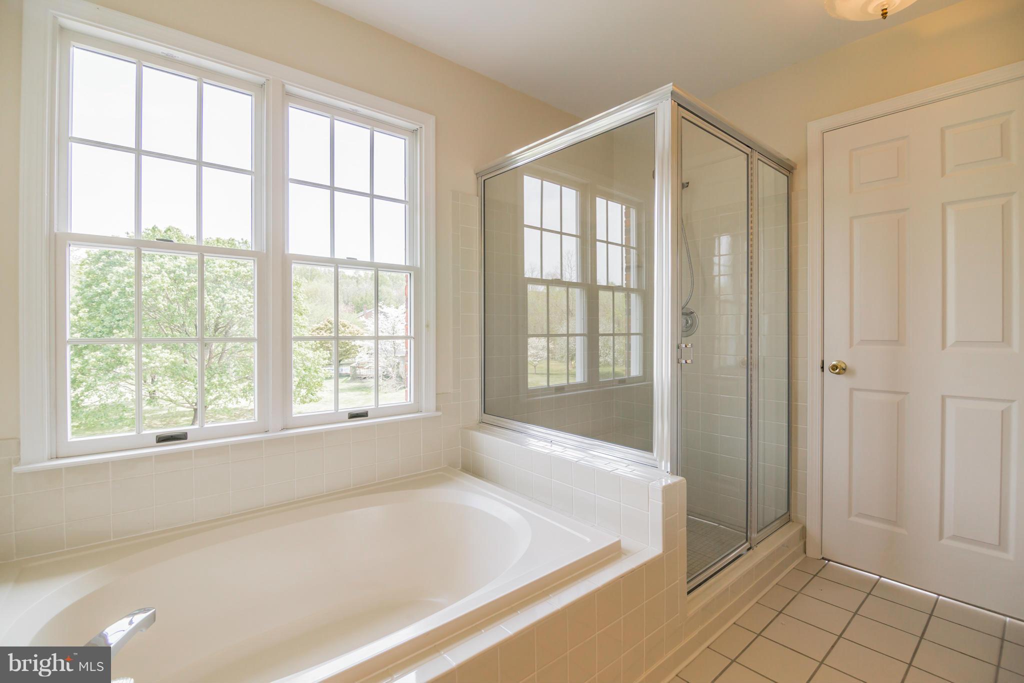 3055 Hickory Ridge Road Dunkirk, MD 20754 - Photo 16 of 29 a spacious bathroom with a bathtub and a shower