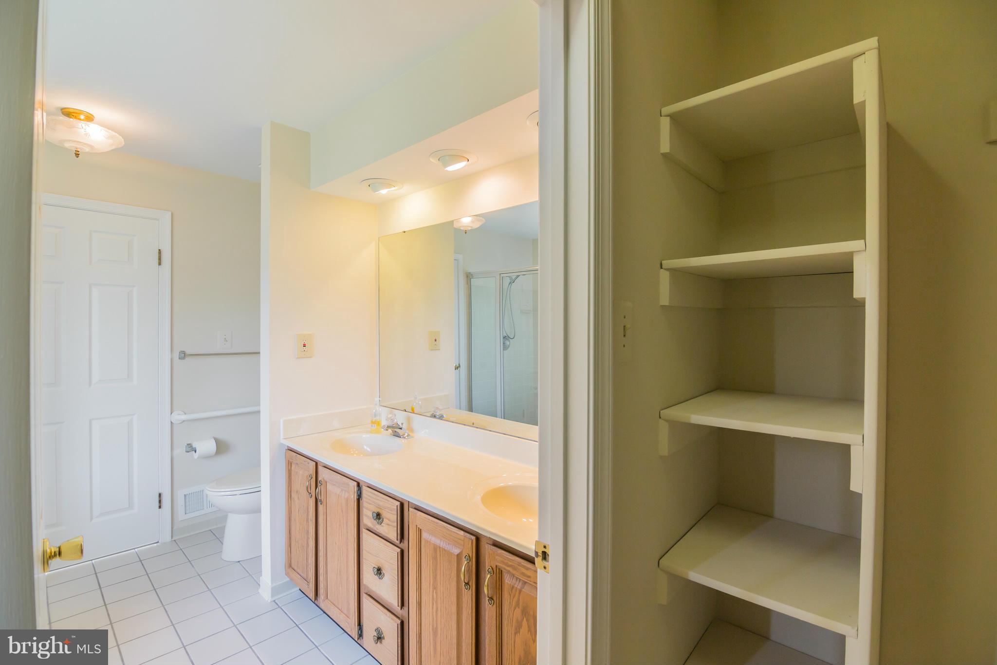 3055 Hickory Ridge Road Dunkirk, MD 20754 - Photo 17 of 29 a bathroom with a double vanity sink and a toilet