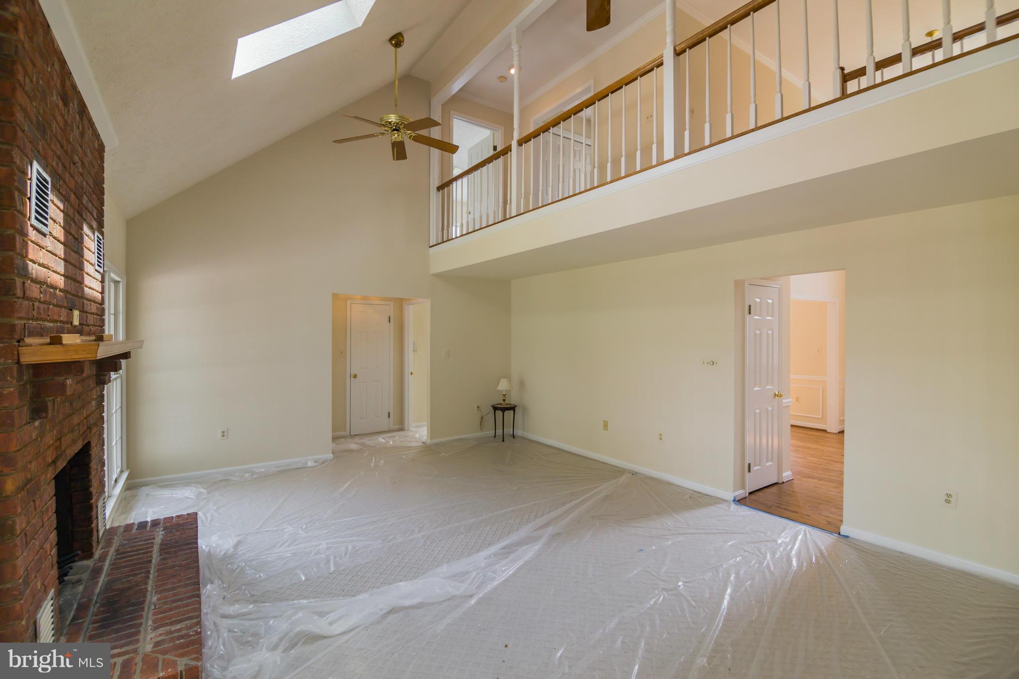 3055 Hickory Ridge Road Dunkirk, MD 20754 - Photo 3 of 29 a view of a livingroom with an empty space and a fireplace