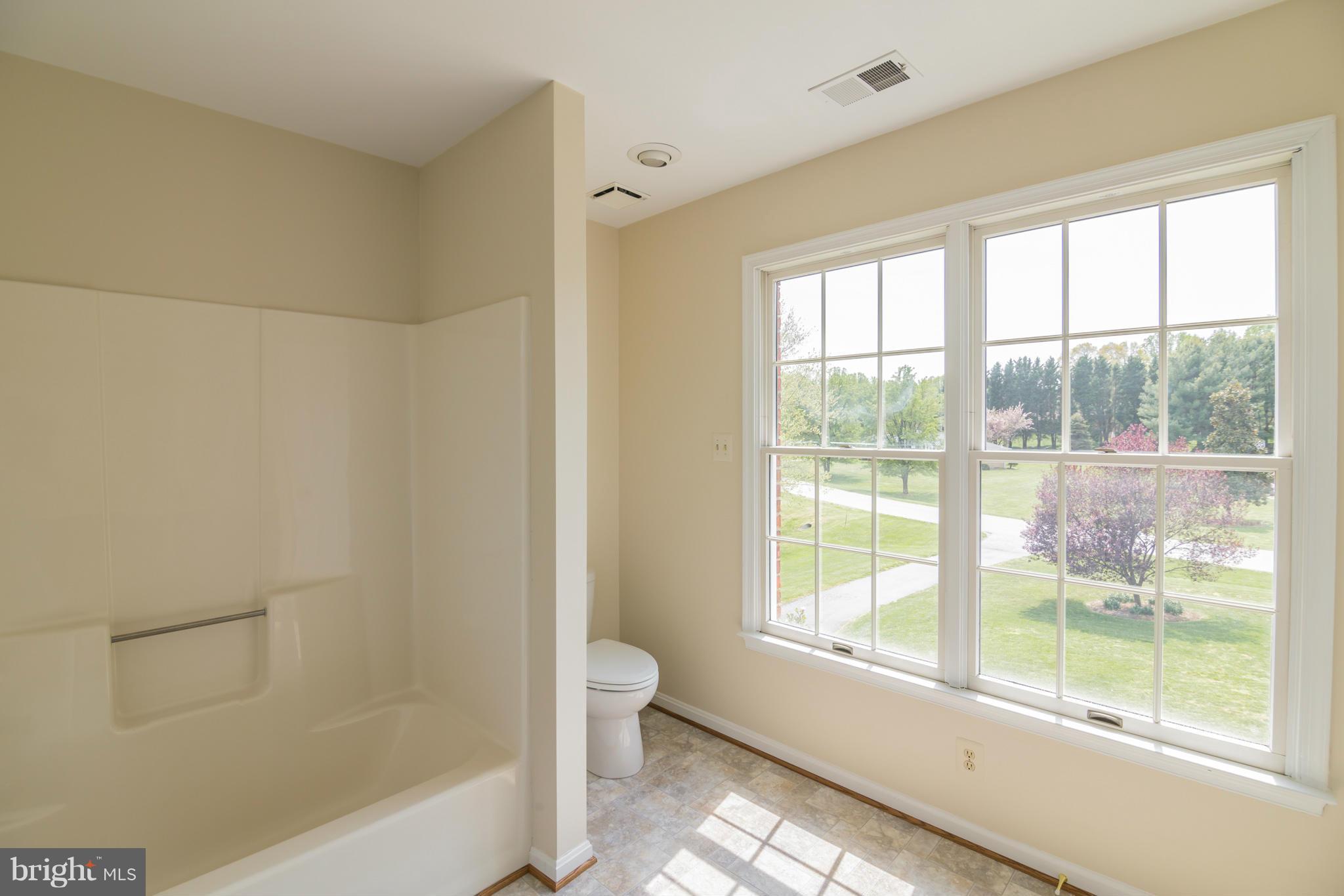 3055 Hickory Ridge Road Dunkirk, MD 20754 - Photo 23 of 29 a bathroom with a bathtub and a shower