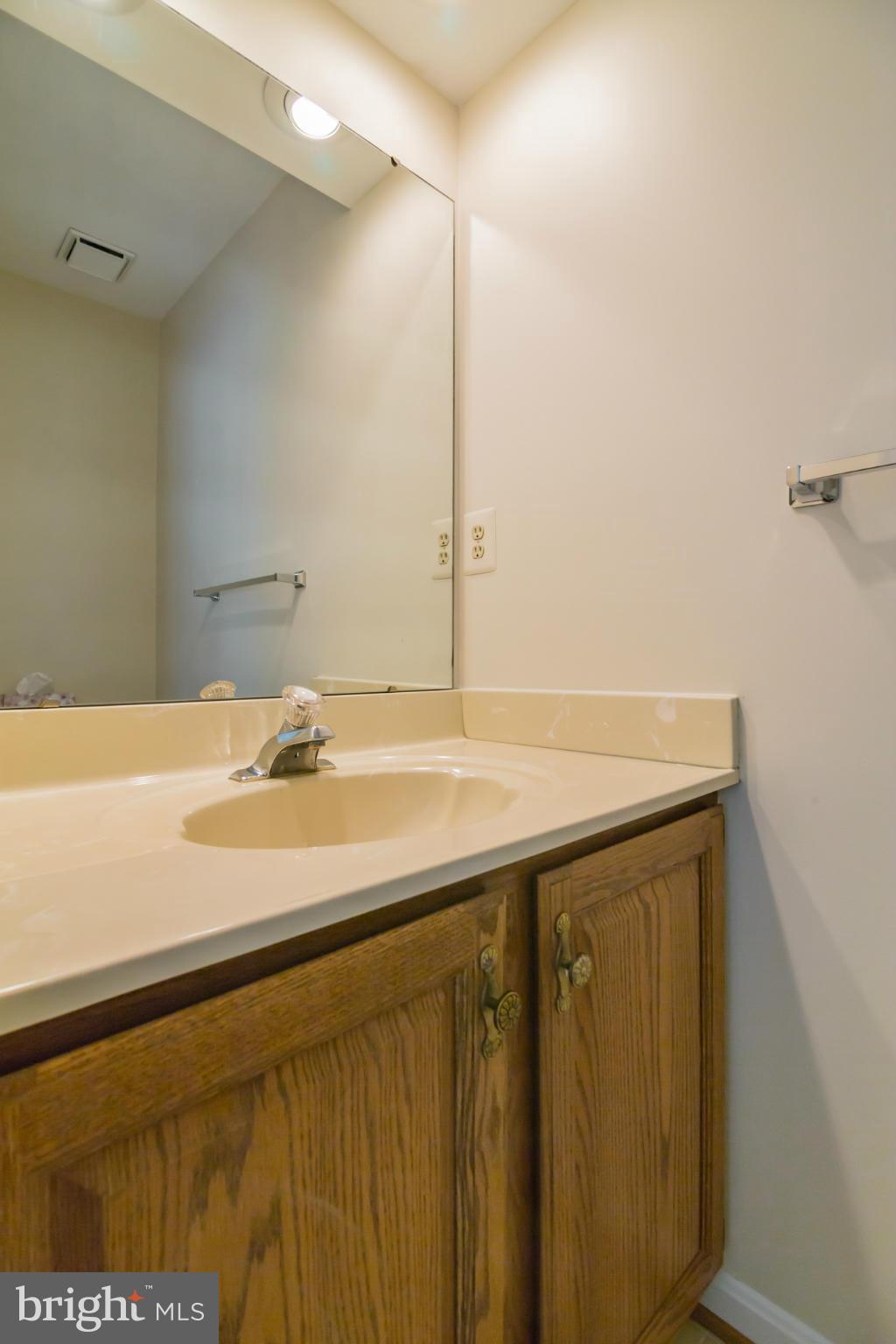 3055 Hickory Ridge Road Dunkirk, MD 20754 - Photo 24 of 29 a bathroom with a sink and a mirror