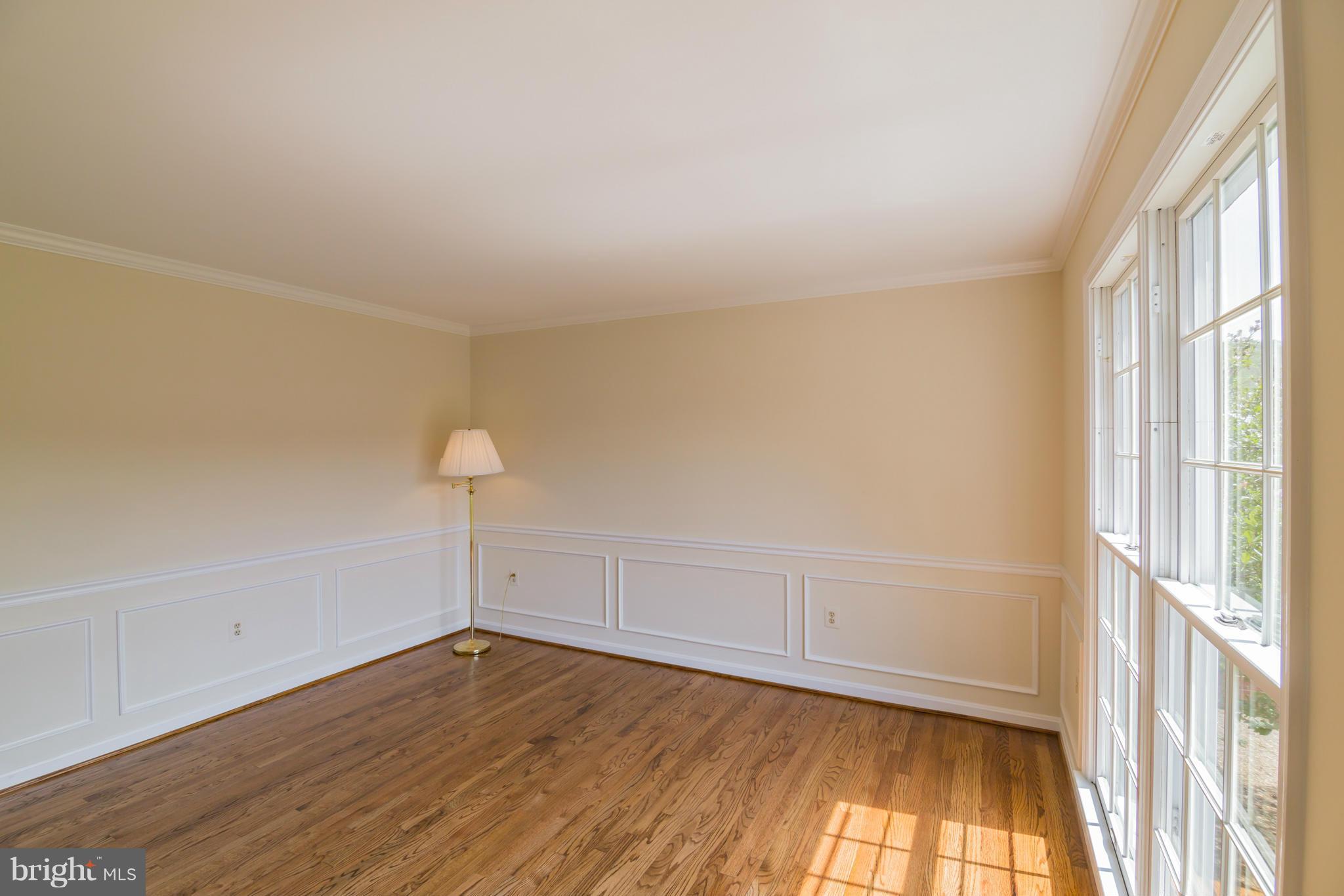 3055 Hickory Ridge Road Dunkirk, MD 20754 - Photo 8 of 29 an empty room with wooden floor and windows