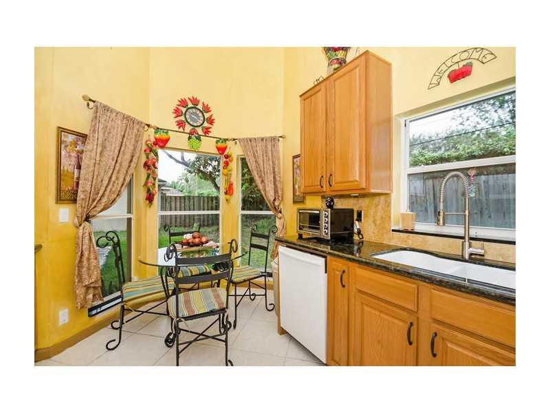 9406 Aegean Drive Boca Raton, FL 33496 - Photo 6 of 17 a kitchen with a sink and a window