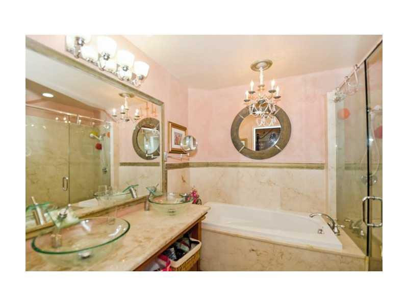 9406 Aegean Drive Boca Raton, FL 33496 - Photo 10 of 17 a bathroom with a sink double vanity and a mirror