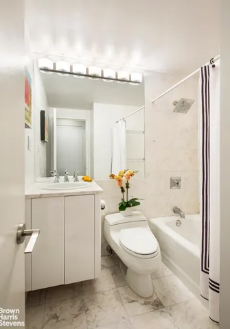 a bathroom with a toilet a sink and a bathtub