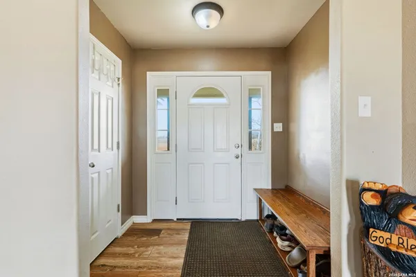 a living room with hard wood flooring and a couch