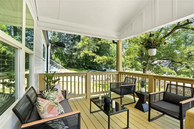 a view of a chairs and table on the balcony