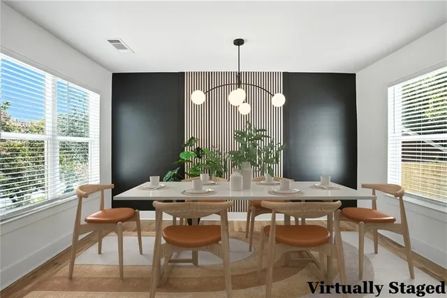 a view of a dining room with furniture and window