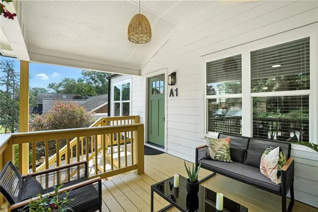 a view of a living room and a balcony