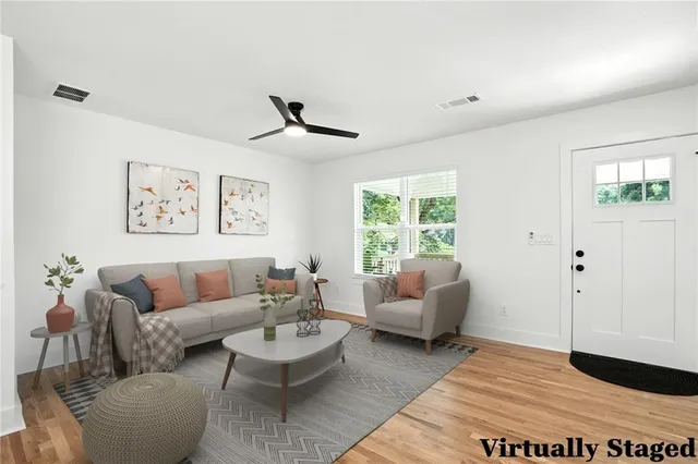 a living room with furniture and a large window