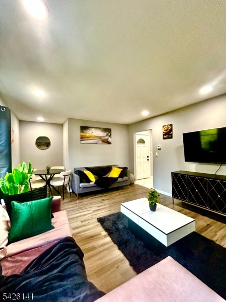 6 Charles Street, Unit 2 Montclair, NJ 07042 - Photo 11 of 13 a living room with furniture and a flat screen tv