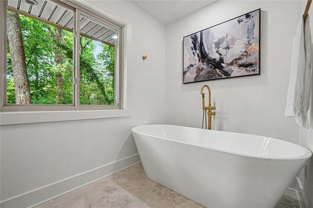 2700 Hawaii Court Decatur, GA 30033 - Photo 16 of 31 a white bath tub sitting in a bathroom