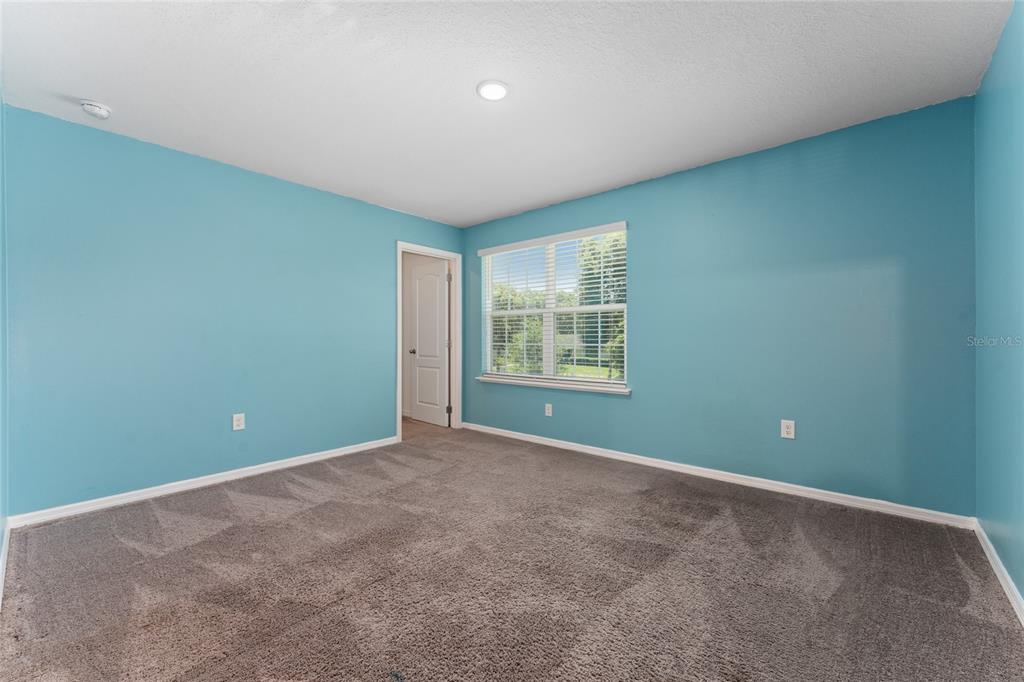 4331 Wayne Road Fruitland Park, FL 34731 - Photo 39 of 46 an empty room with windows