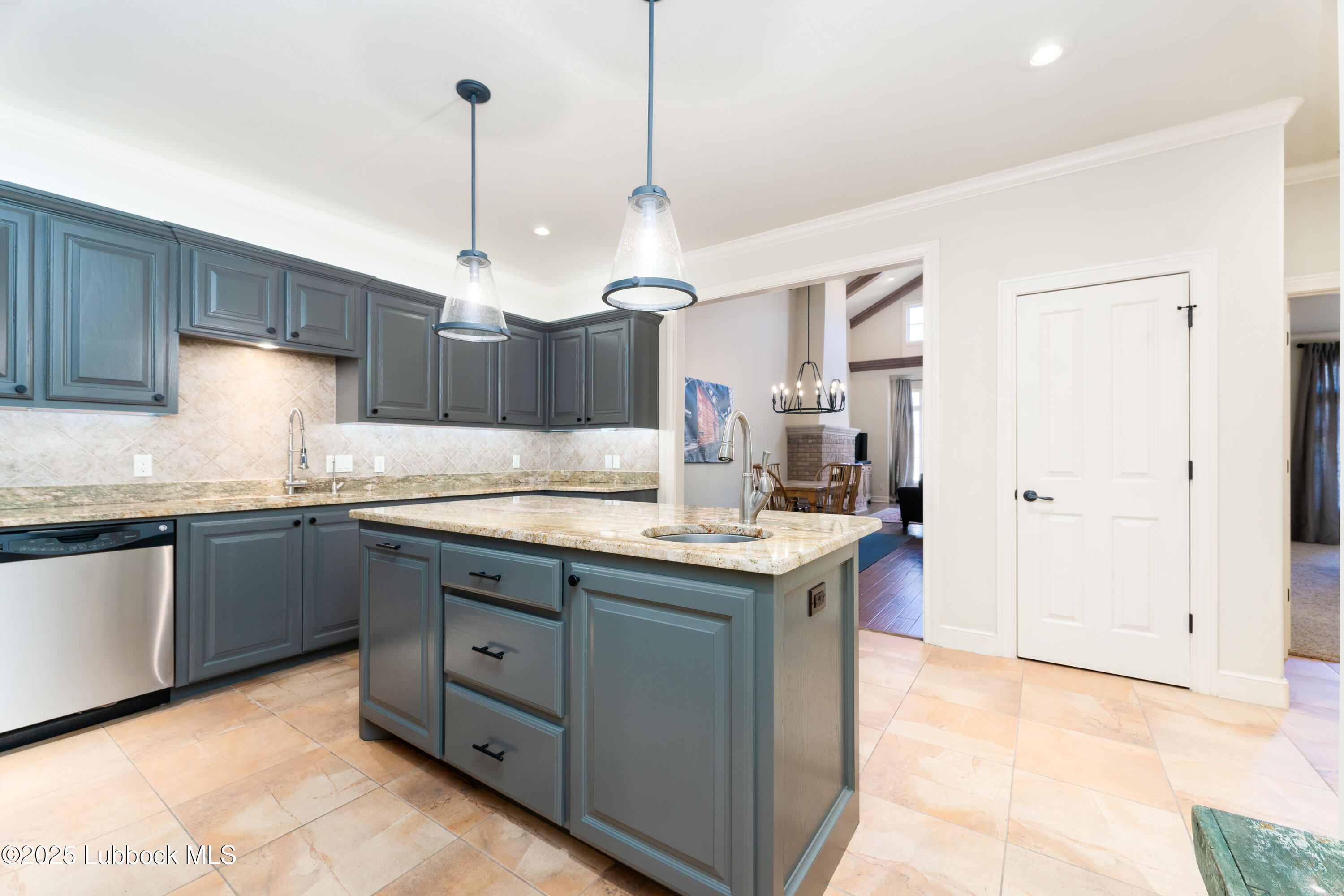 4501 19th Street, Unit 7 Lubbock, TX 79407 - Photo 11 of 30 a kitchen with granite countertop a sink and a refrigerator