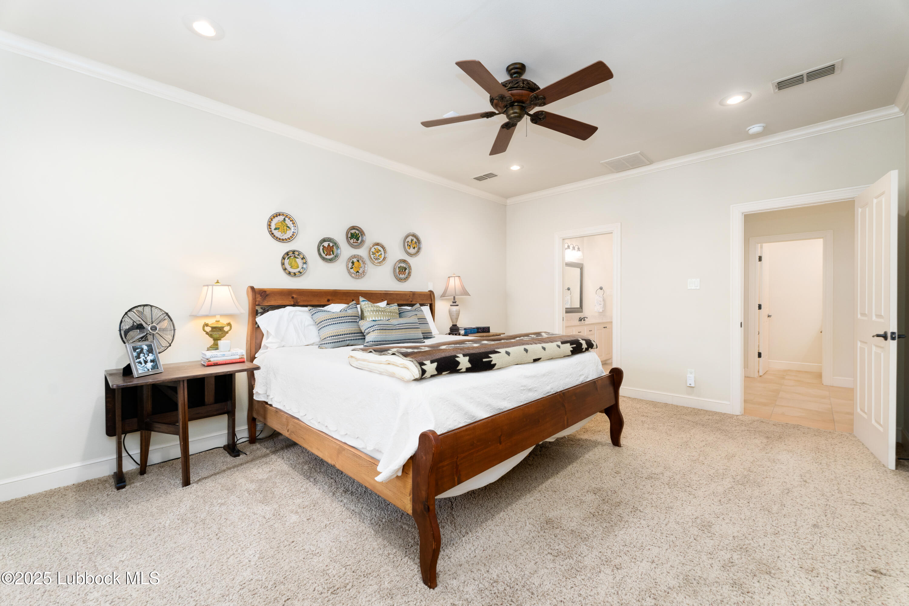 4501 19th Street, Unit 7 Lubbock, TX 79407 - Photo 14 of 30 a bedroom with a bed and a table in it