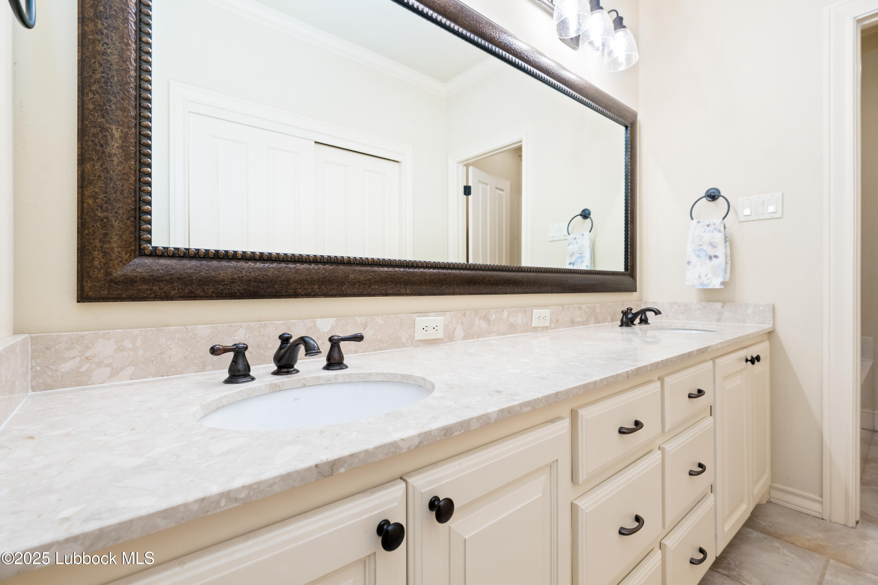 4501 19th Street, Unit 7 Lubbock, TX 79407 - Photo 15 of 30 a bathroom with double sink and a mirror