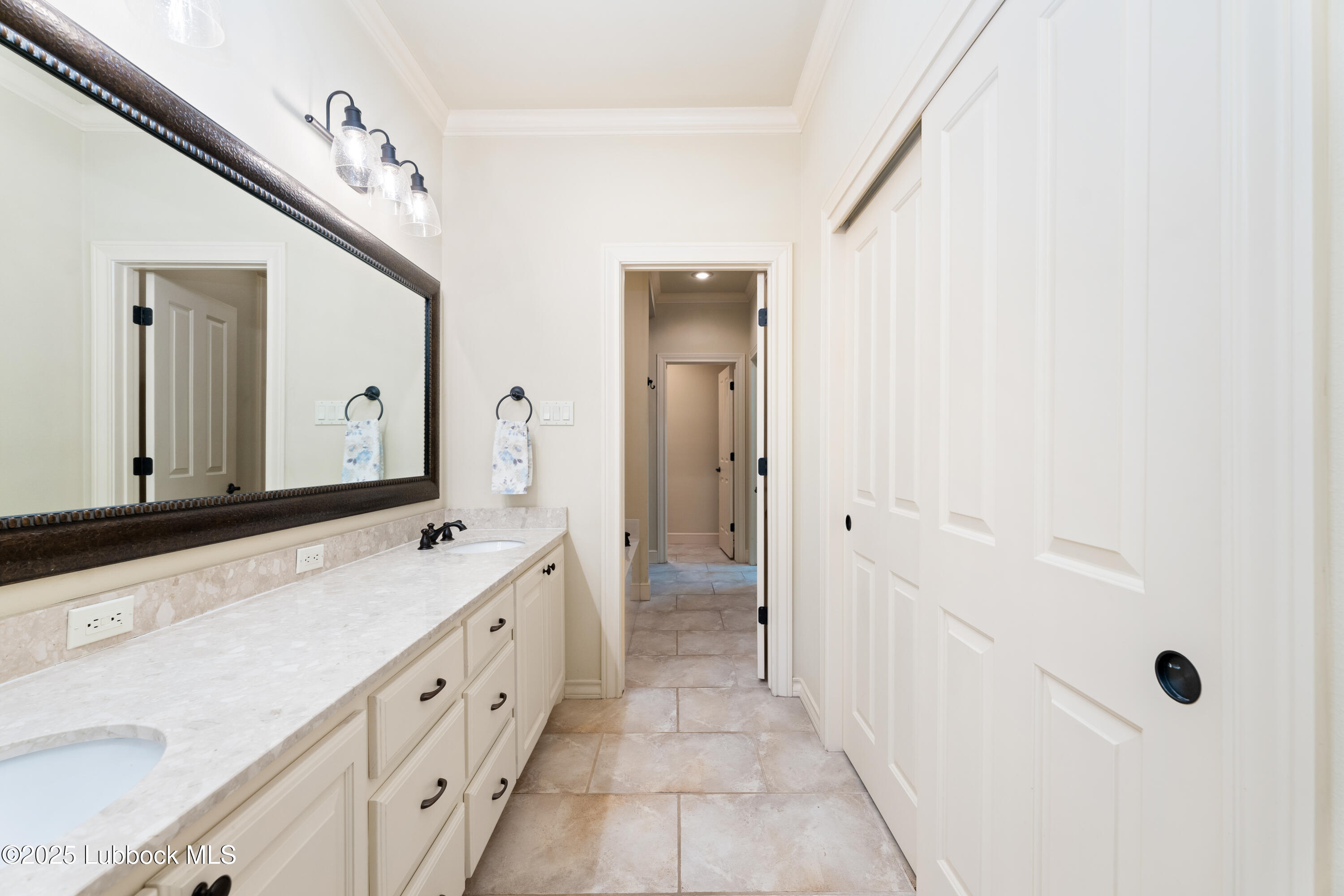 4501 19th Street, Unit 7 Lubbock, TX 79407 - Photo 17 of 30 a spacious bathroom with a double vanity sink mirror and
