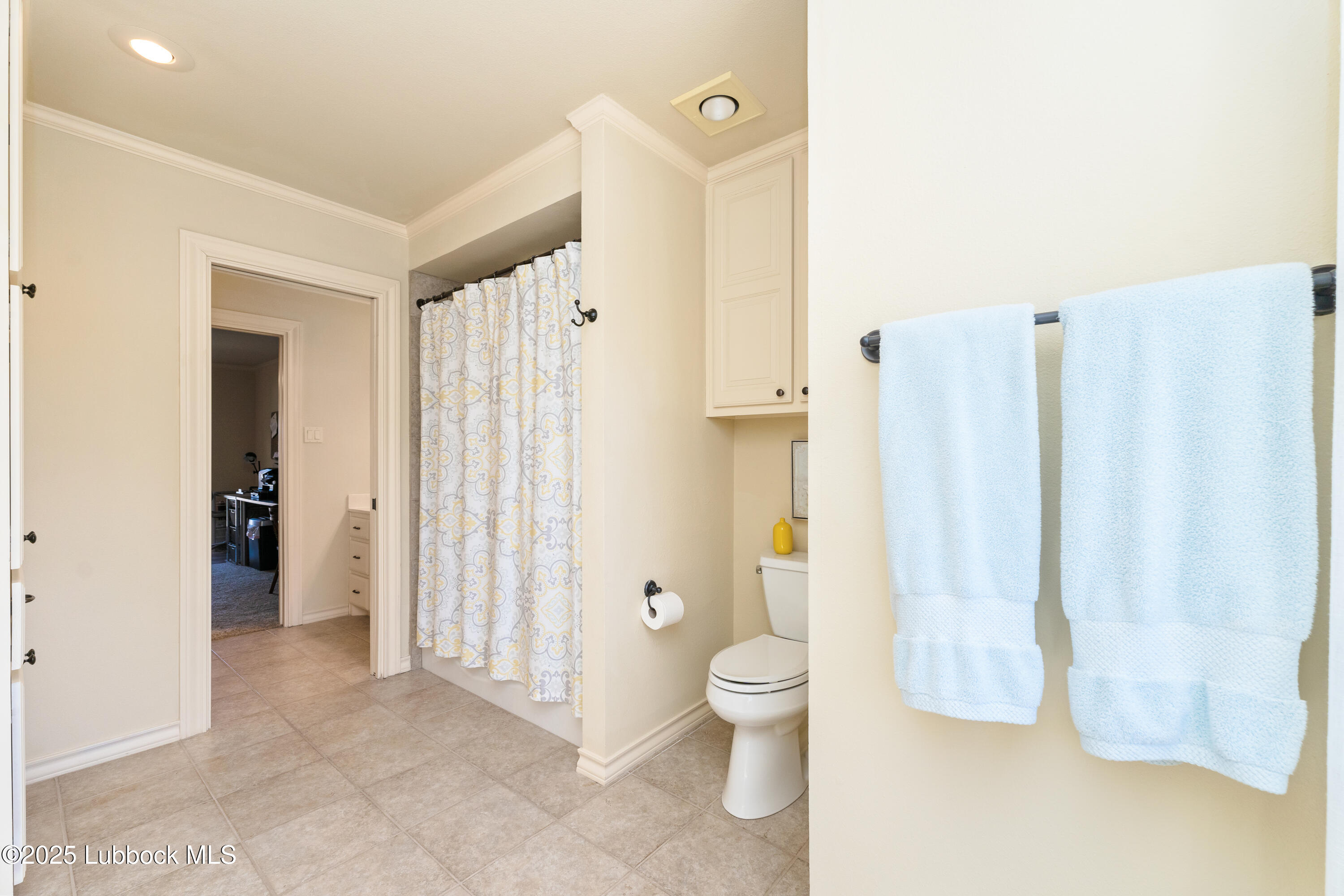 4501 19th Street, Unit 7 Lubbock, TX 79407 - Photo 20 of 30 a bathroom with a toilet sink and shower