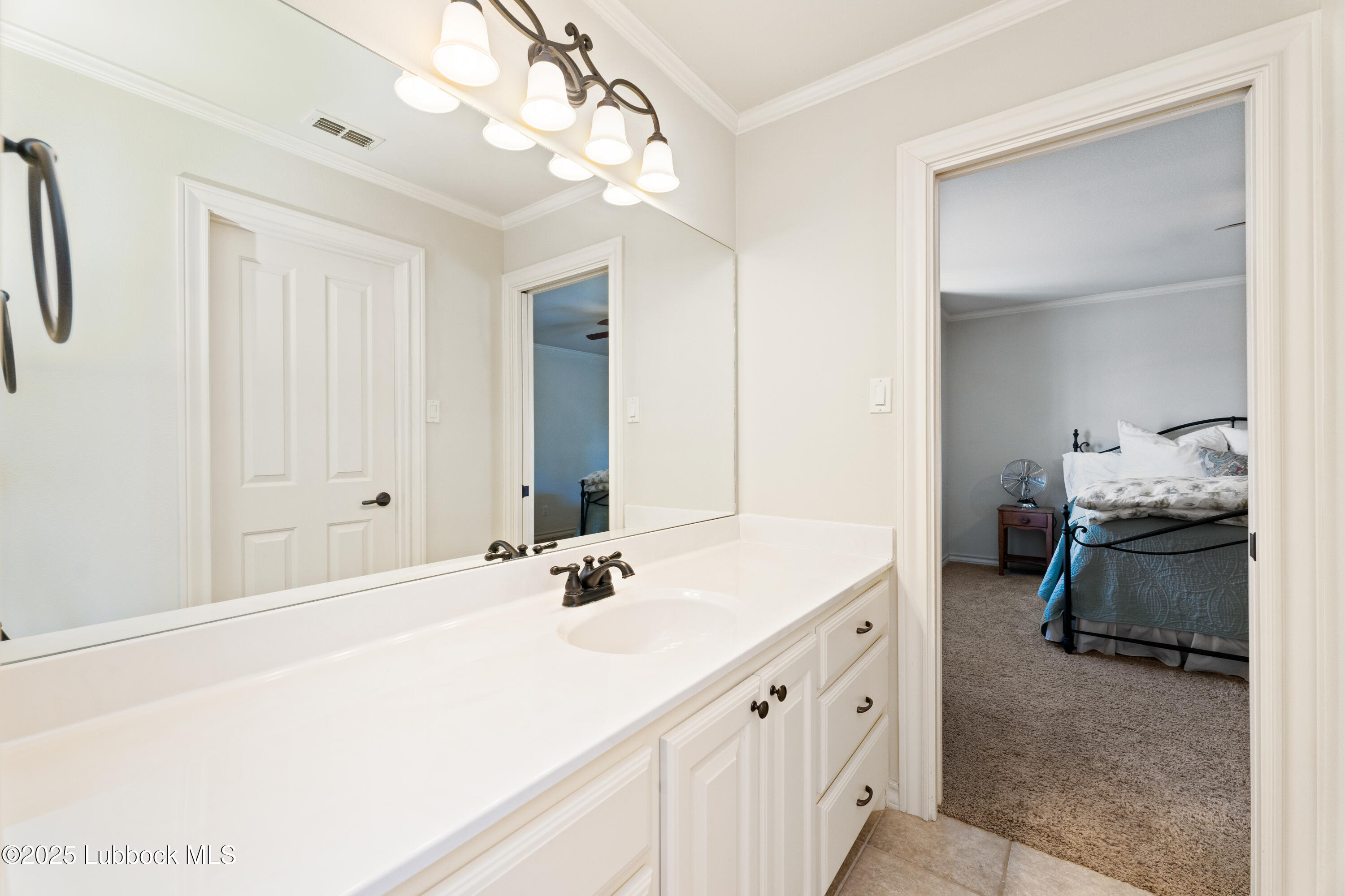 4501 19th Street, Unit 7 Lubbock, TX 79407 - Photo 23 of 30 a en suite bathroom with double sink and a mirror