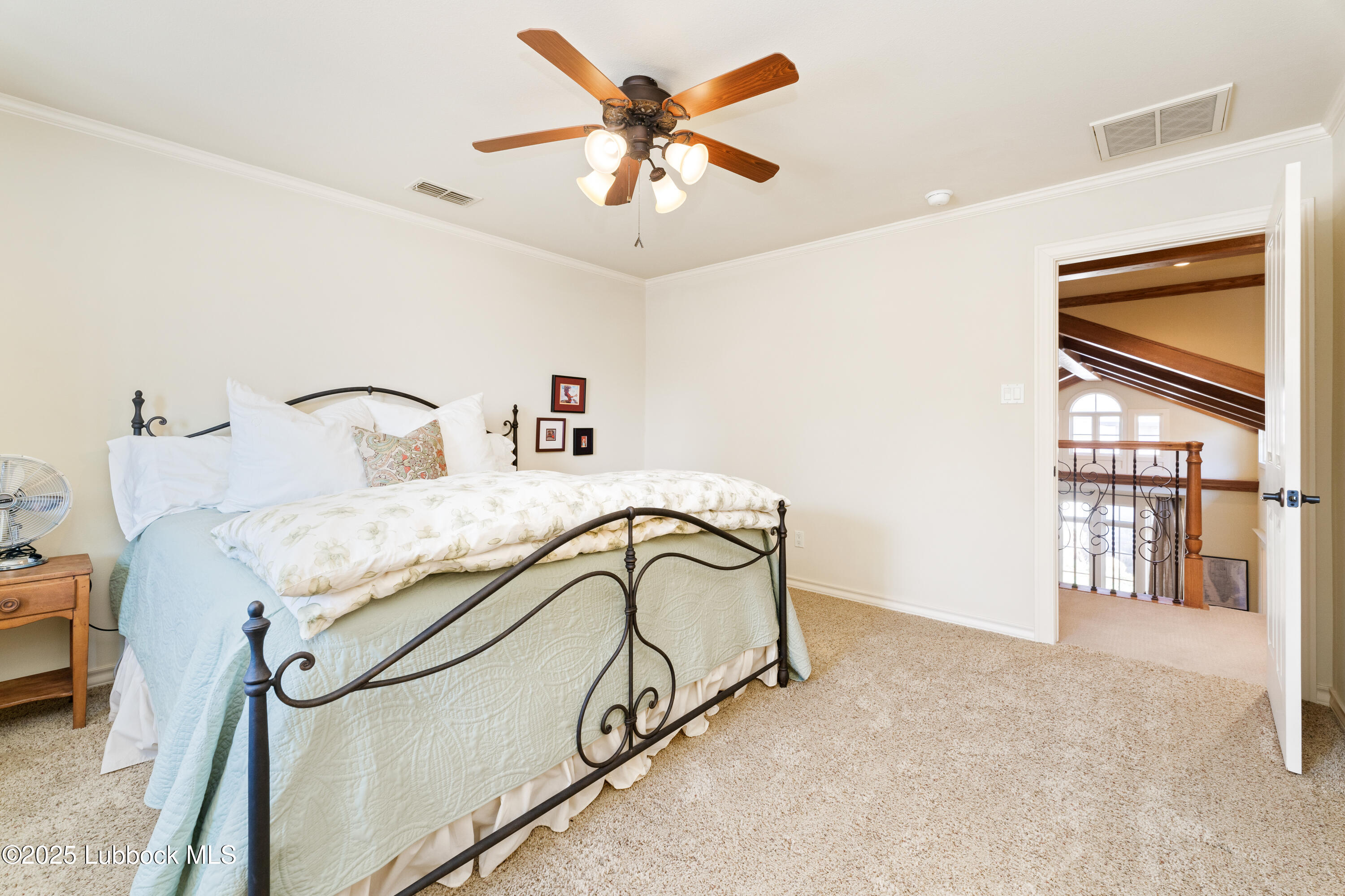 4501 19th Street, Unit 7 Lubbock, TX 79407 - Photo 26 of 30 a bedroom with a bed dresser and a window