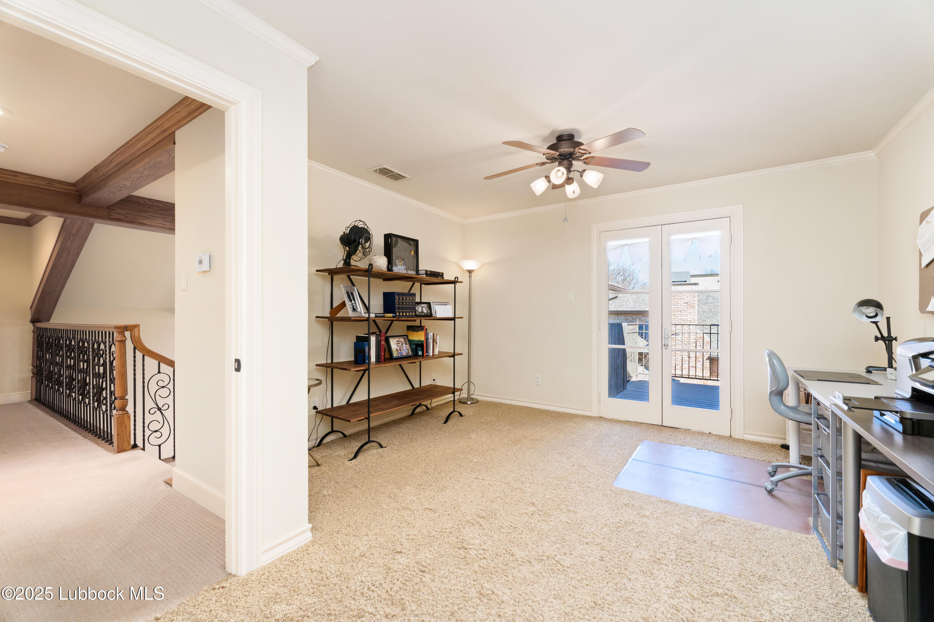 4501 19th Street, Unit 7 Lubbock, TX 79407 - Photo 27 of 30 a view of a livingroom with a furniture and a ceiling fan