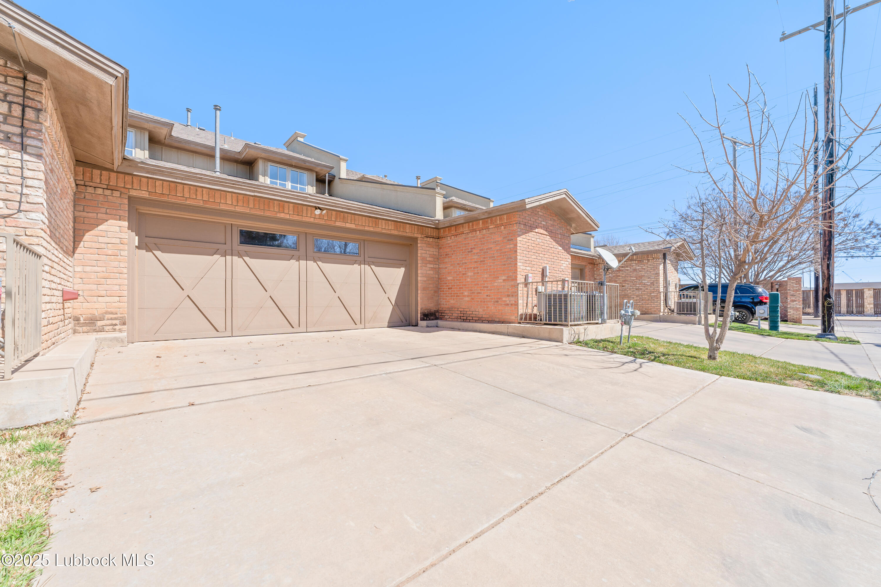 4501 19th Street, Unit 7 Lubbock, TX 79407 - Photo 30 of 30 a view of a house with a snow on the road