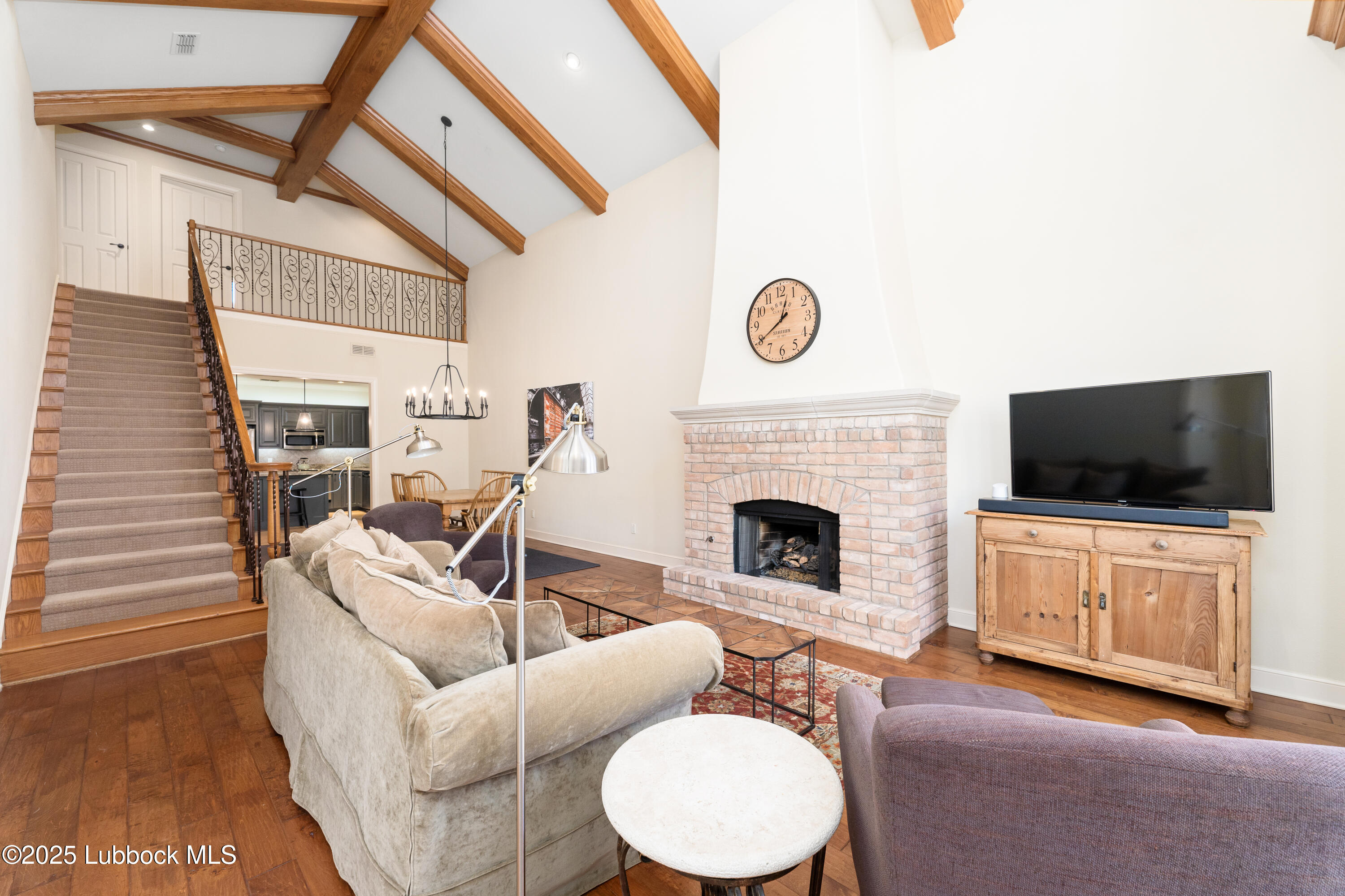 4501 19th Street, Unit 7 Lubbock, TX 79407 - Photo 4 of 30 a living room with furniture and a flat screen tv