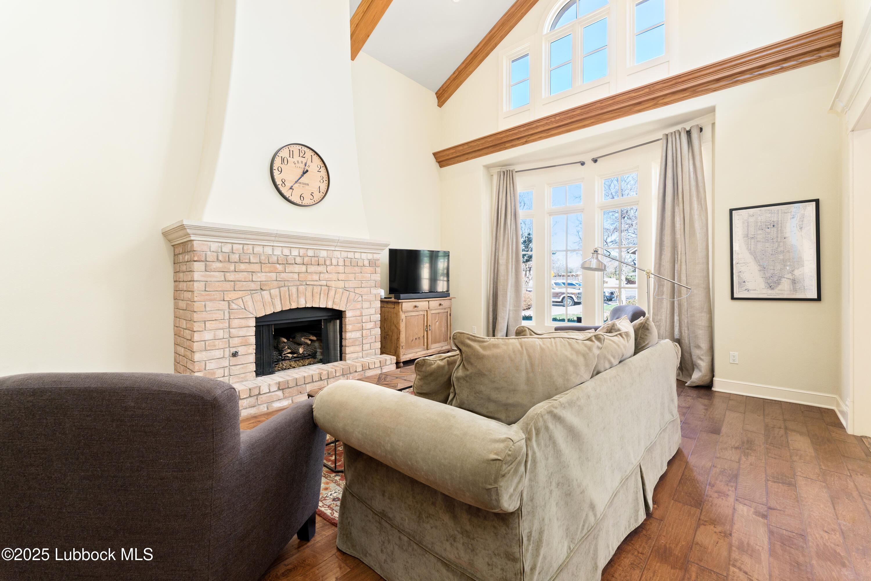 4501 19th Street, Unit 7 Lubbock, TX 79407 - Photo 5 of 30 a living room with furniture and a fireplace