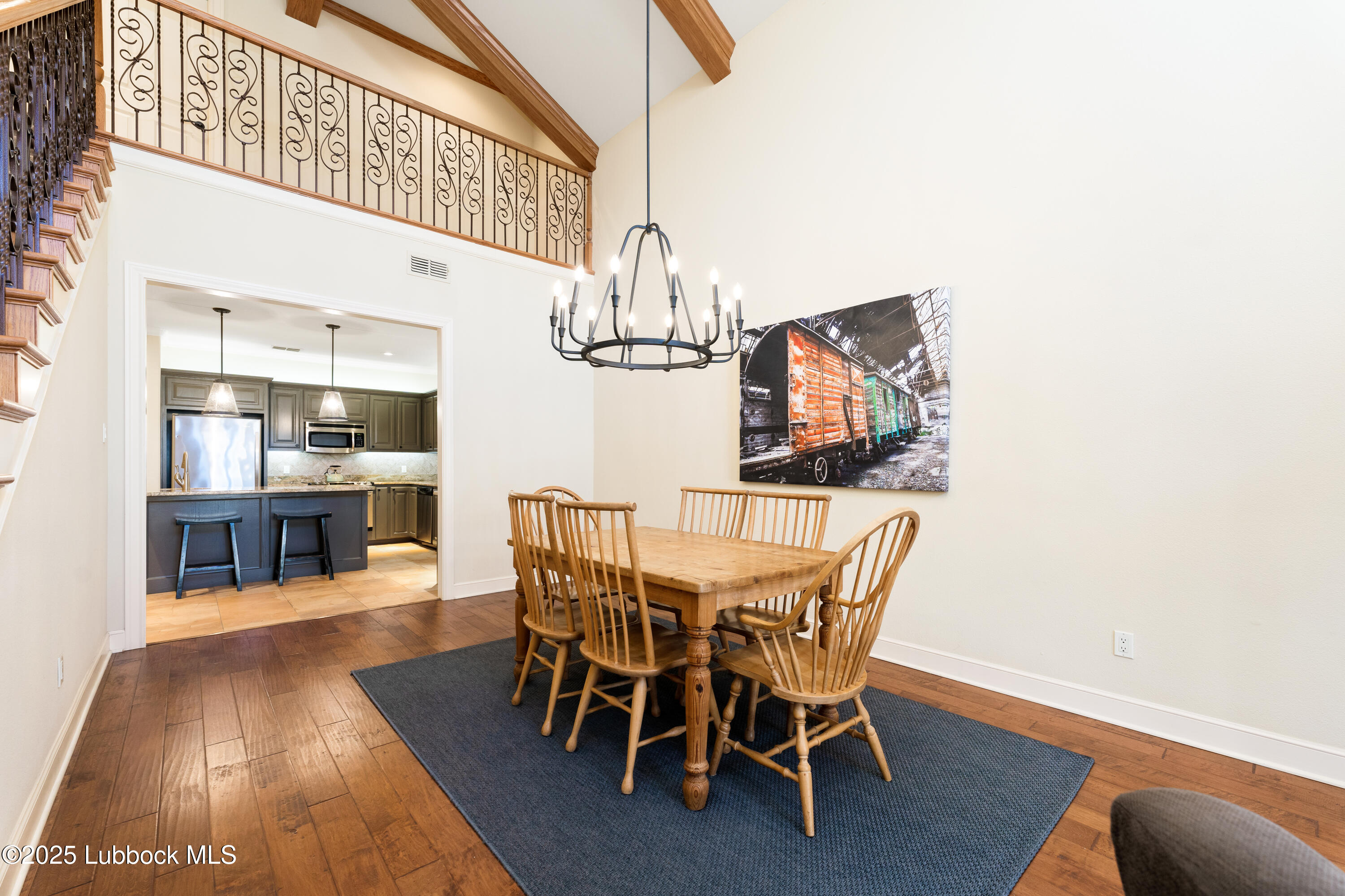 4501 19th Street, Unit 7 Lubbock, TX 79407 - Photo 7 of 30 a view of a dining room with furniture and wooden floor