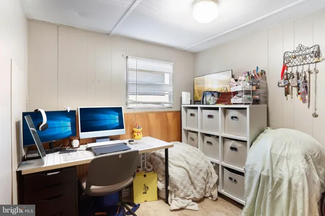 a view of a workspace with furniture