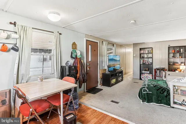 a kitchen with stainless steel appliances granite countertop a stove a refrigerator and a sink