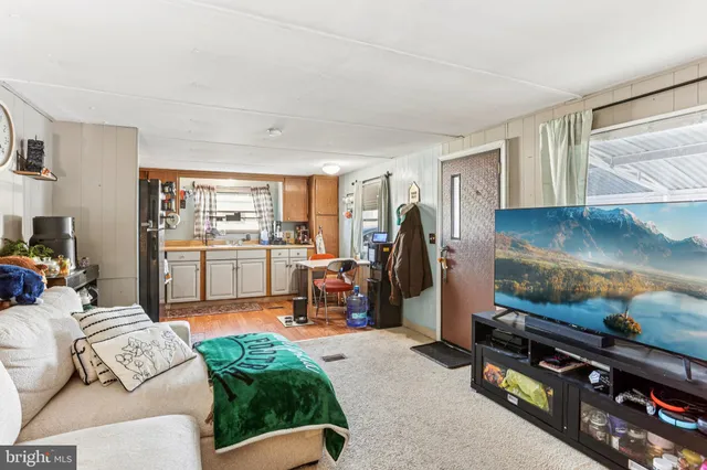 a kitchen with granite countertop a sink appliances and cabinets