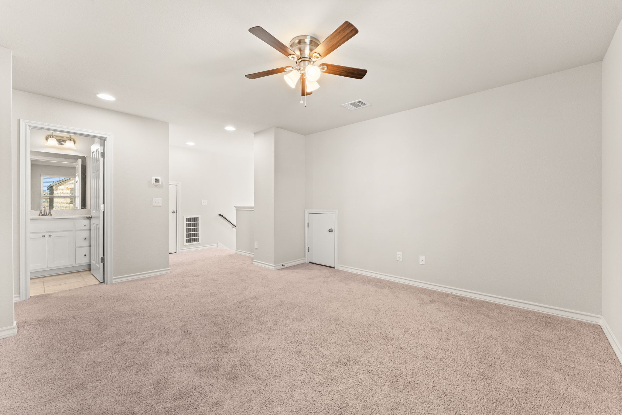 740 Aliso Trail Leander, TX 78641 - Photo 23 of 35 The room's central location connects conveniently to both guest bedrooms.