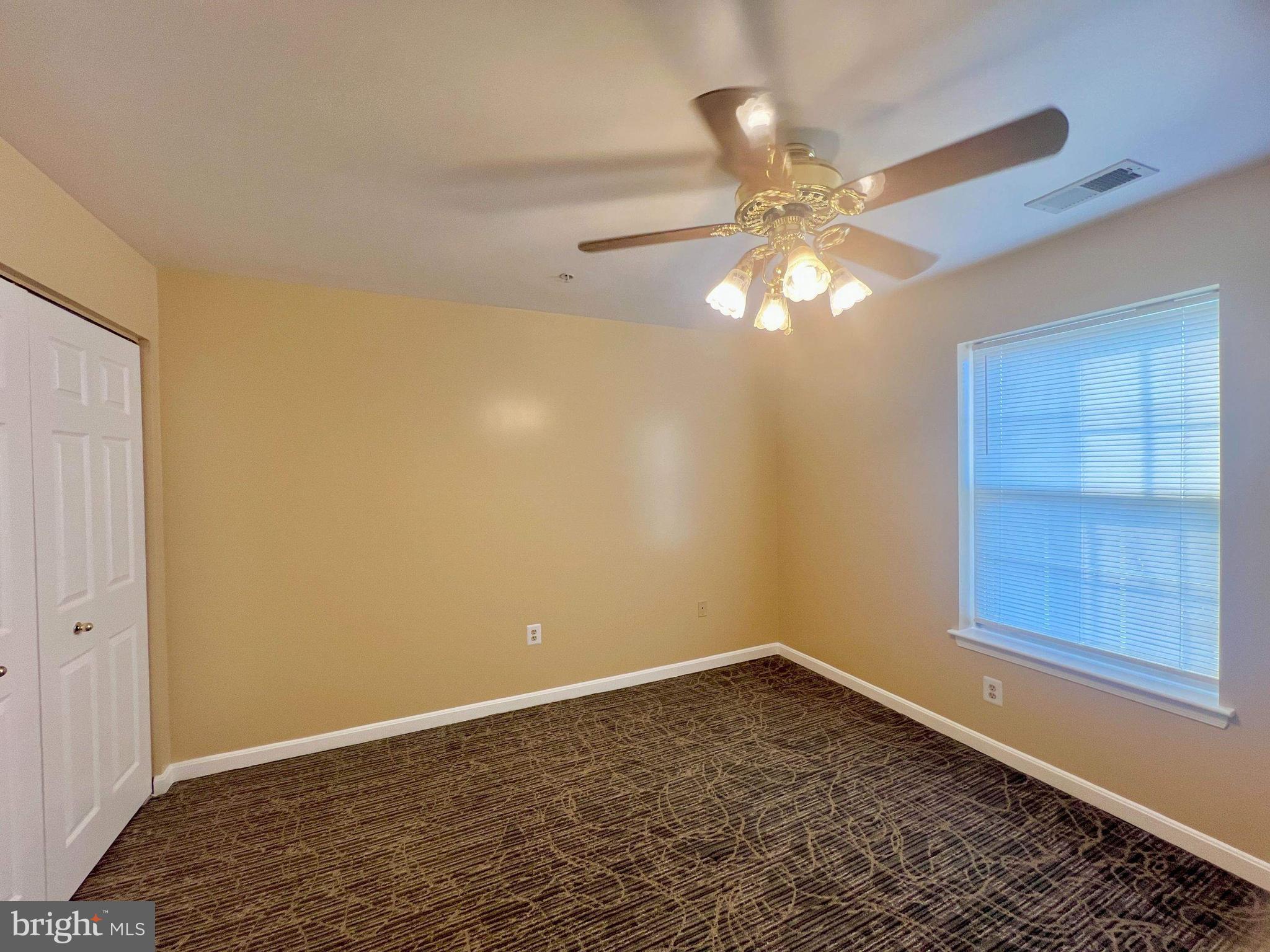6502 Home Water Court, Unit 303 Glen Burnie, MD 21060 - Photo 13 of 14 wooden floor in an empty room with a window