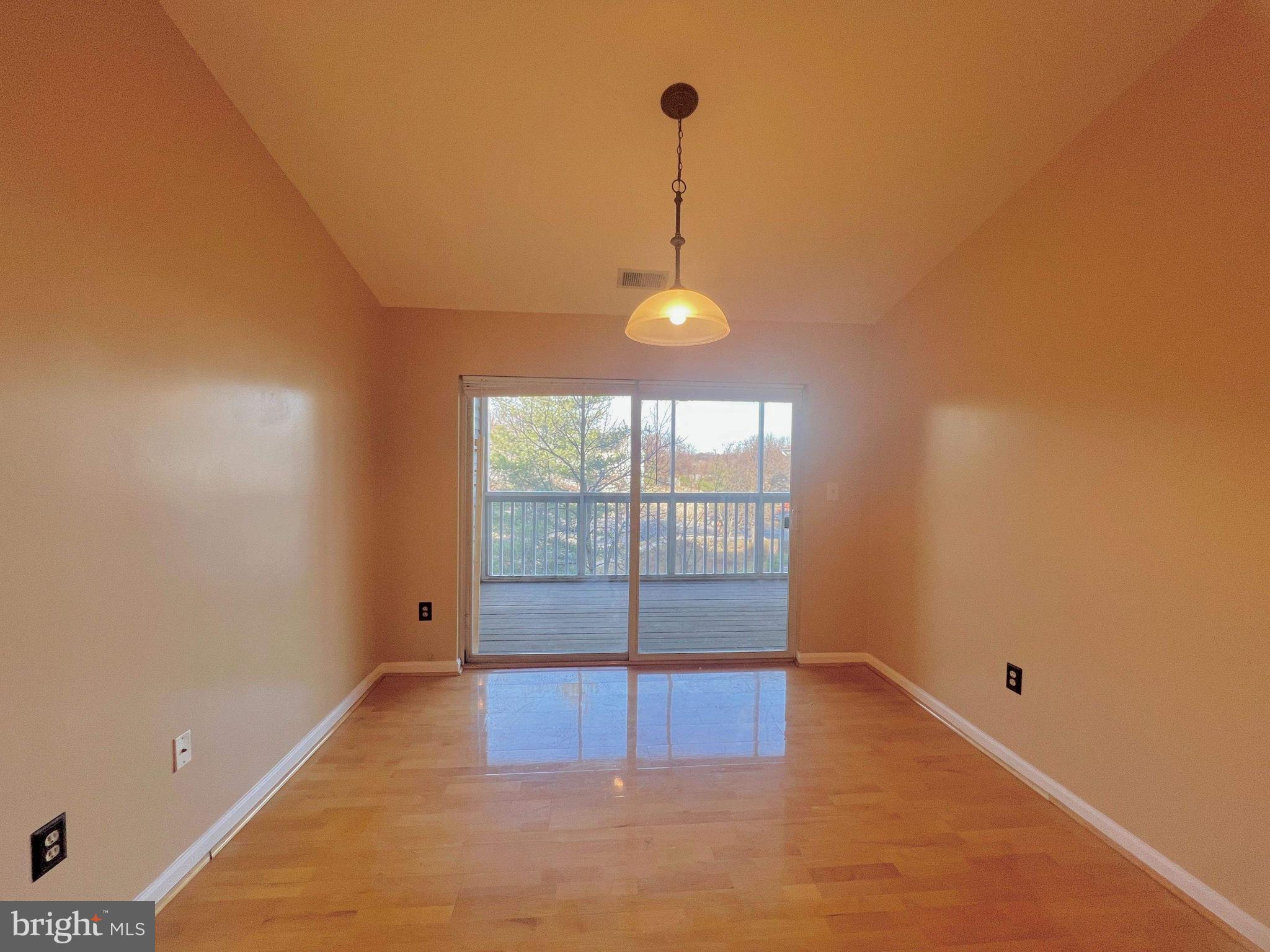 6502 Home Water Court, Unit 303 Glen Burnie, MD 21060 - Photo 3 of 14 a view of an empty room with window