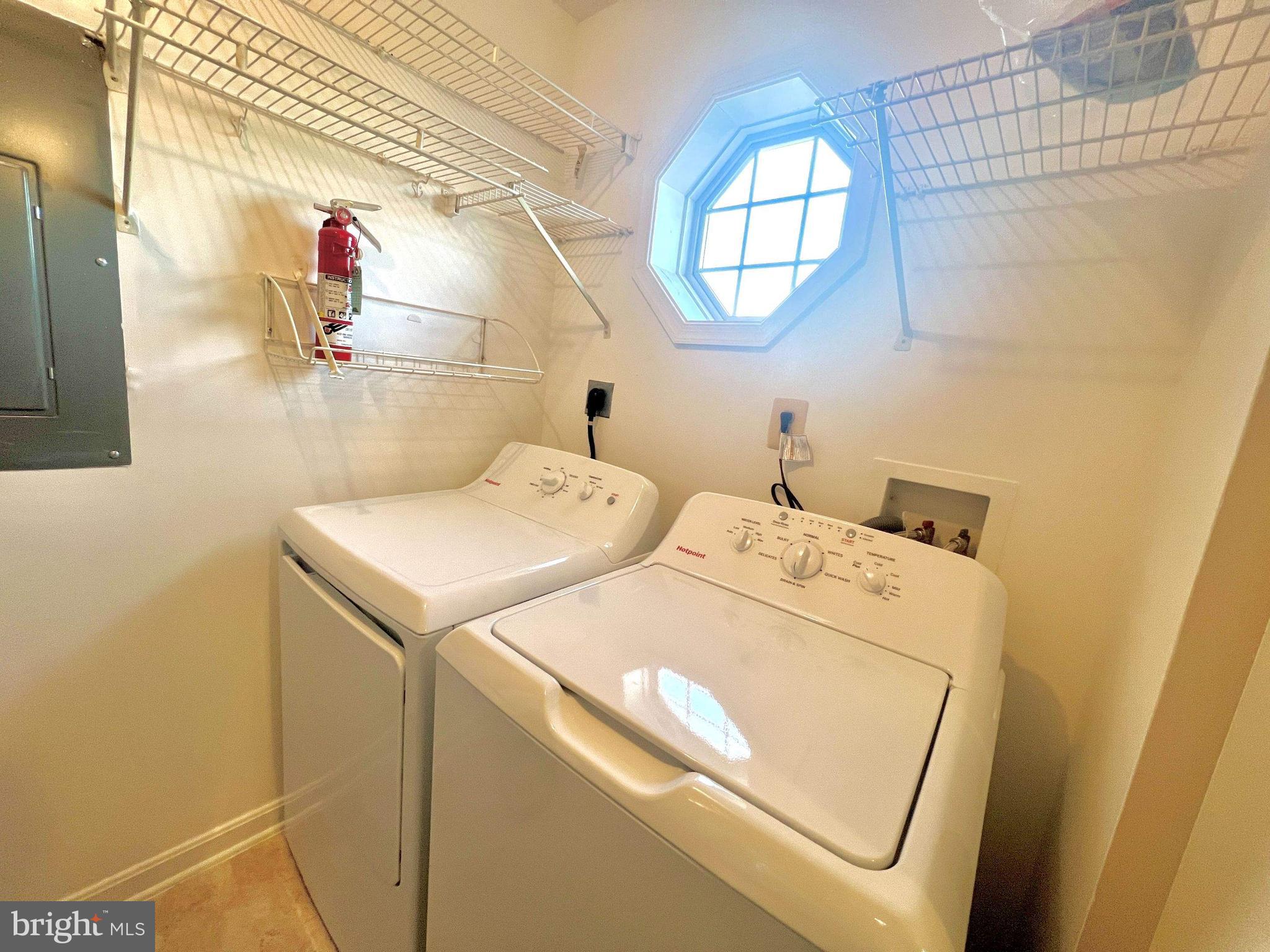 6502 Home Water Court, Unit 303 Glen Burnie, MD 21060 - Photo 8 of 14 a utility room with dryer and washer