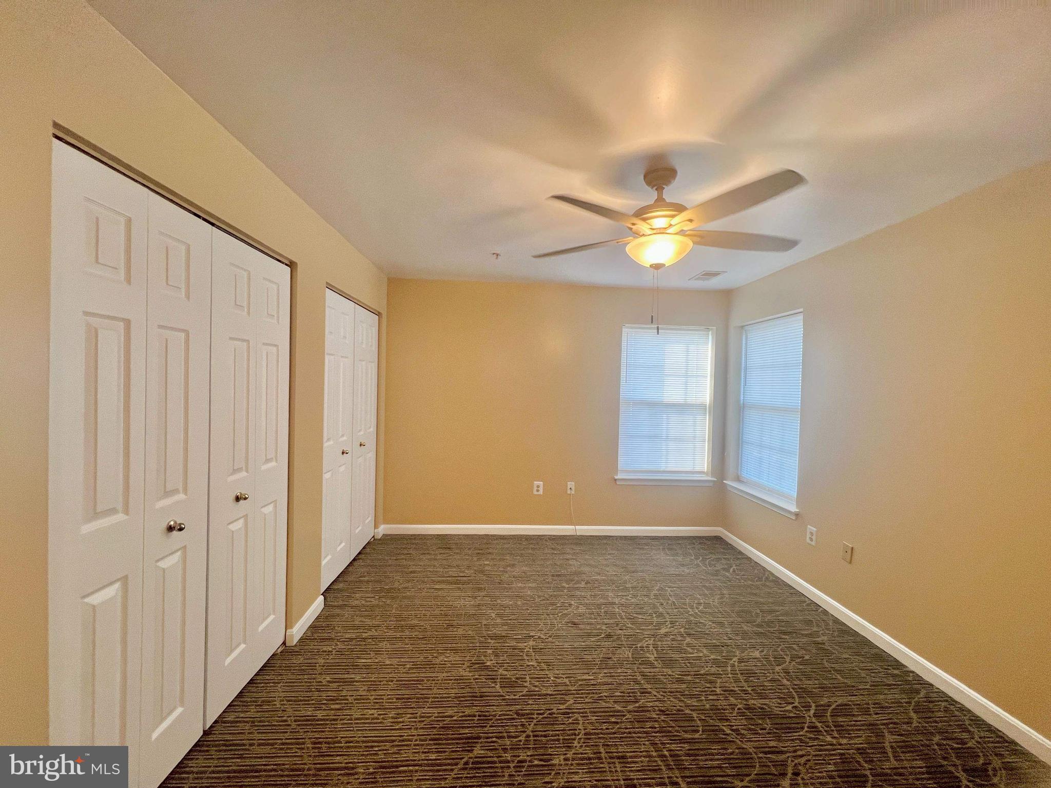 6502 Home Water Court, Unit 303 Glen Burnie, MD 21060 - Photo 10 of 14 a view of an empty room with a window